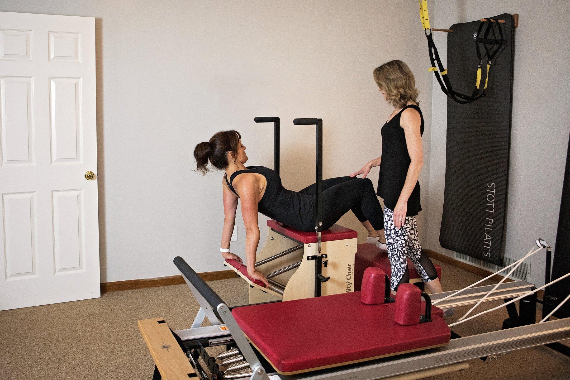 A client working on the STOTT PILATES Stability Chair